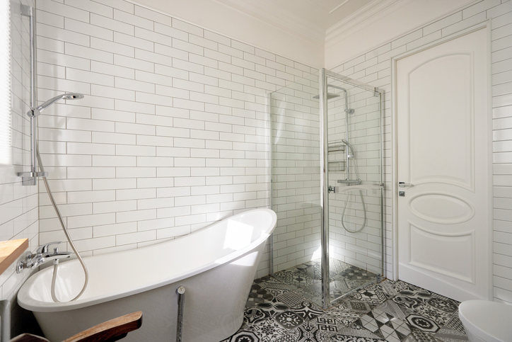 An Elegant And Modern Bathroom Featuring A Luxurious Freestanding Bathtub Along With A Stylish Shower Space An Elegant And Modern Bathroom Featuring A Luxurious Freestanding Bathtub Along With A Stylish Shower Space